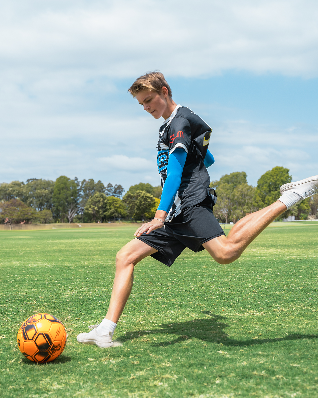 Image of a soccer player wearing SParms every day sleeves for kids.